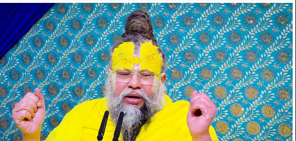 Premanand Ji Maharaj both fists raised while making a point during satsang