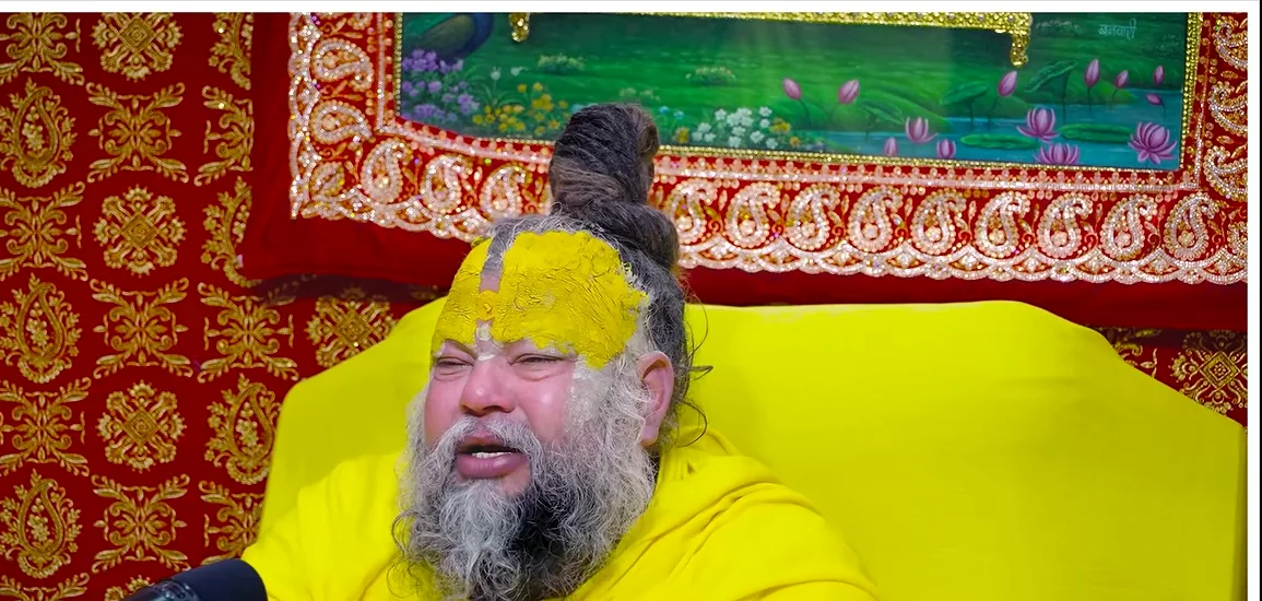Premanand Ji Maharaj a portrait before a red and green backdrop
